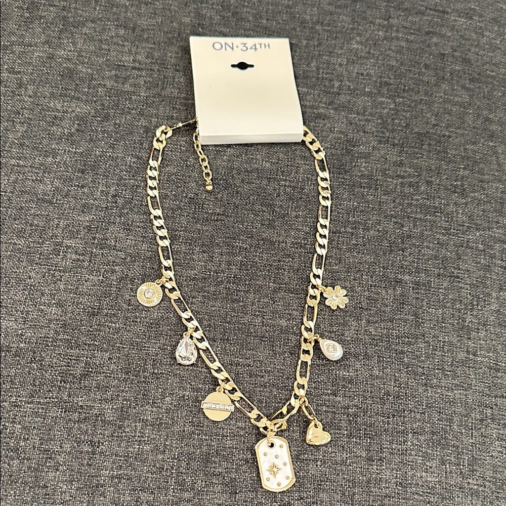 Charming Gold and White Necklace with Charms